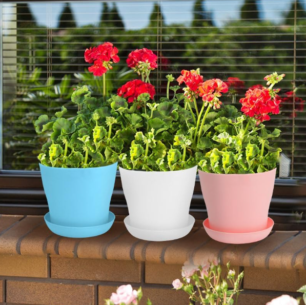 Set Of Small, Colorful Plastic Seedling Pots With Drainage Holes